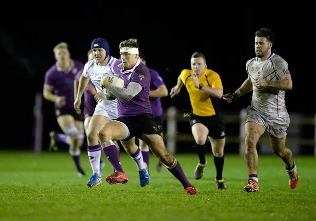 Two rugby teams on the pitch
